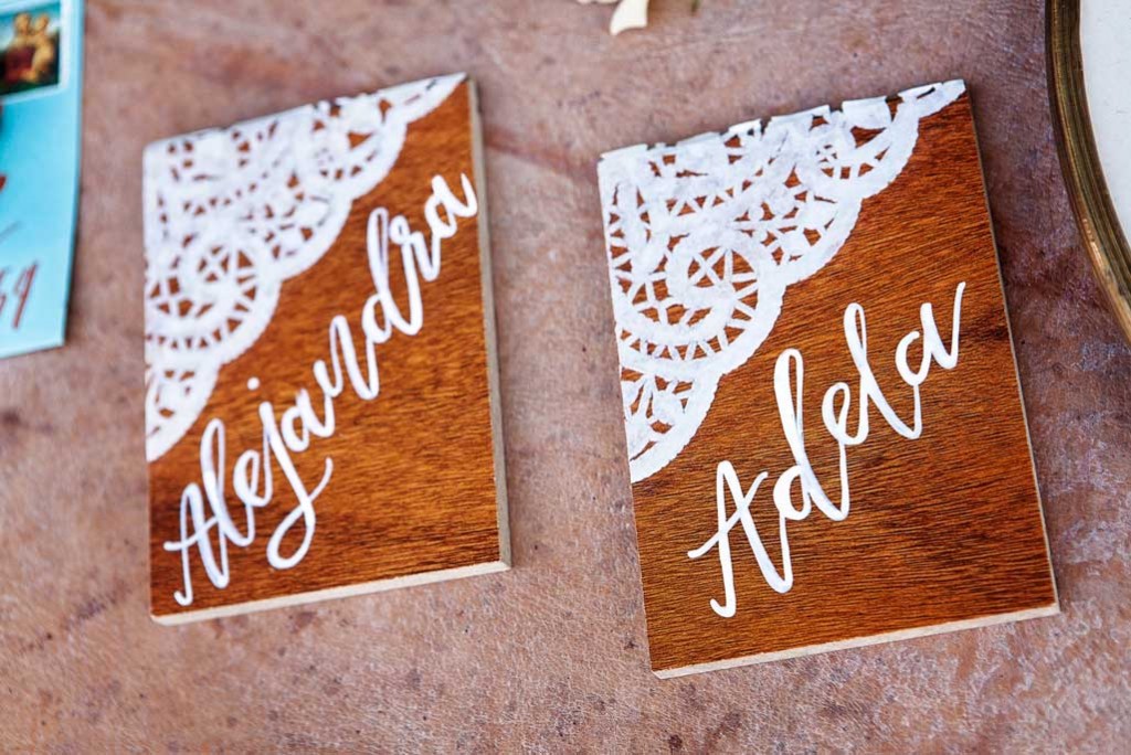 wooden and lace placards for wedding reception at rustic Mexican lesbian wedding