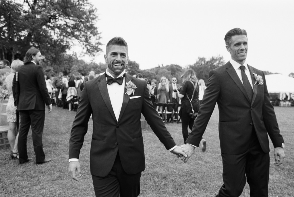 Vineyard wedding in Nashville grooms holding hands