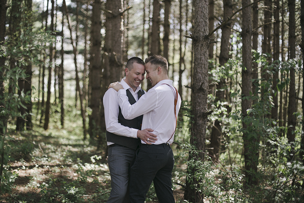 This wooded nature wedding styled shoot infused hints of masculinity, whiskey and nature to create beautiful photos for this couple.