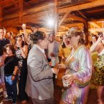 two brides dancing at their wedding reception