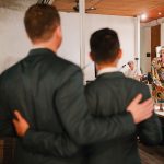 Two grooms at the reception