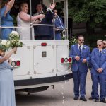Popping Champagne on Trolley Muskegon Lesbian Wedding
