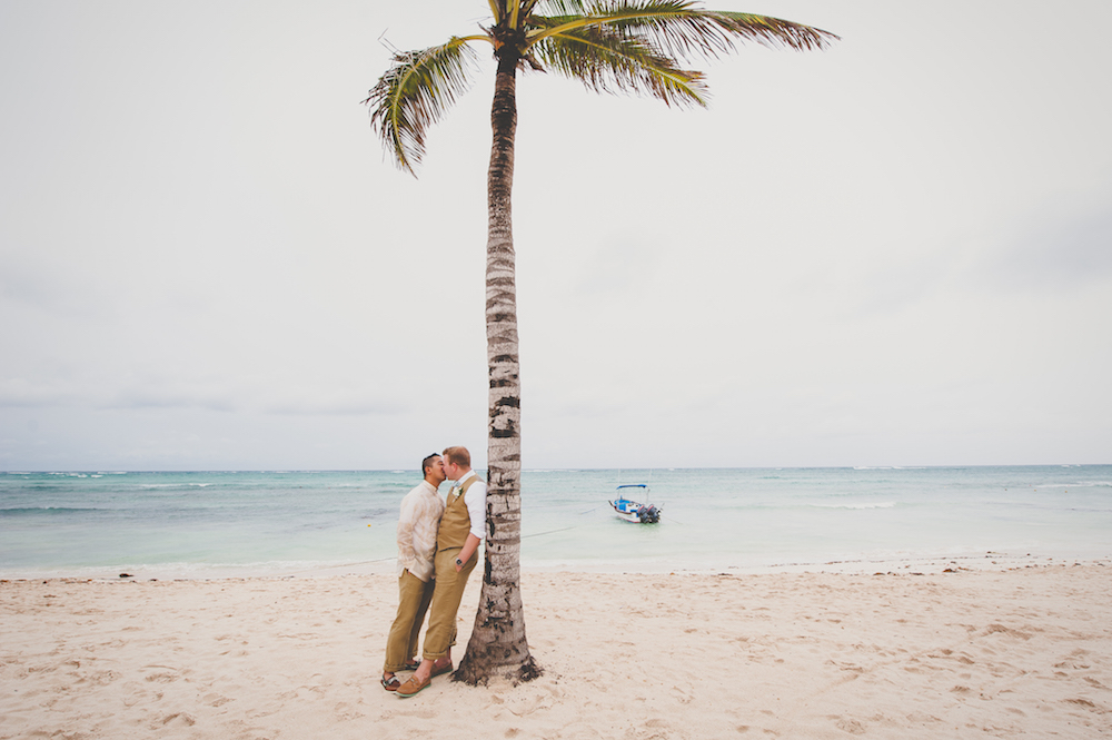 will-ritchie-beach-wedding-palm-tree-kiss-LGBTQ-grooms-love
