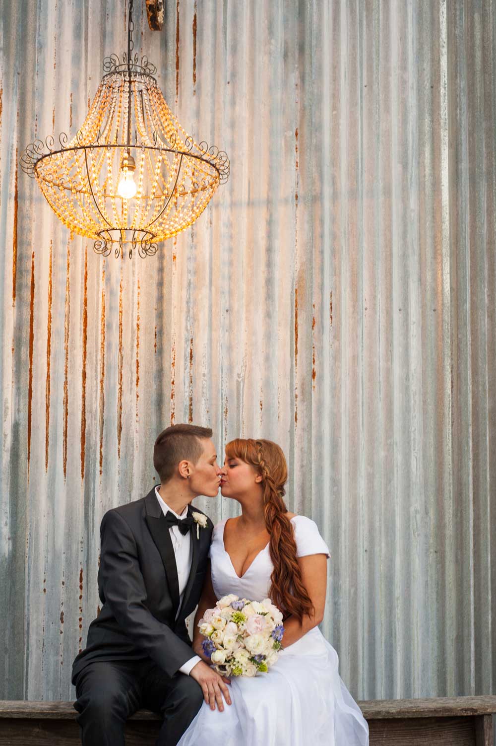 you-are-raven-lesbian-wedding-kiss-butch-femme-chandelier-styled-shoot-59