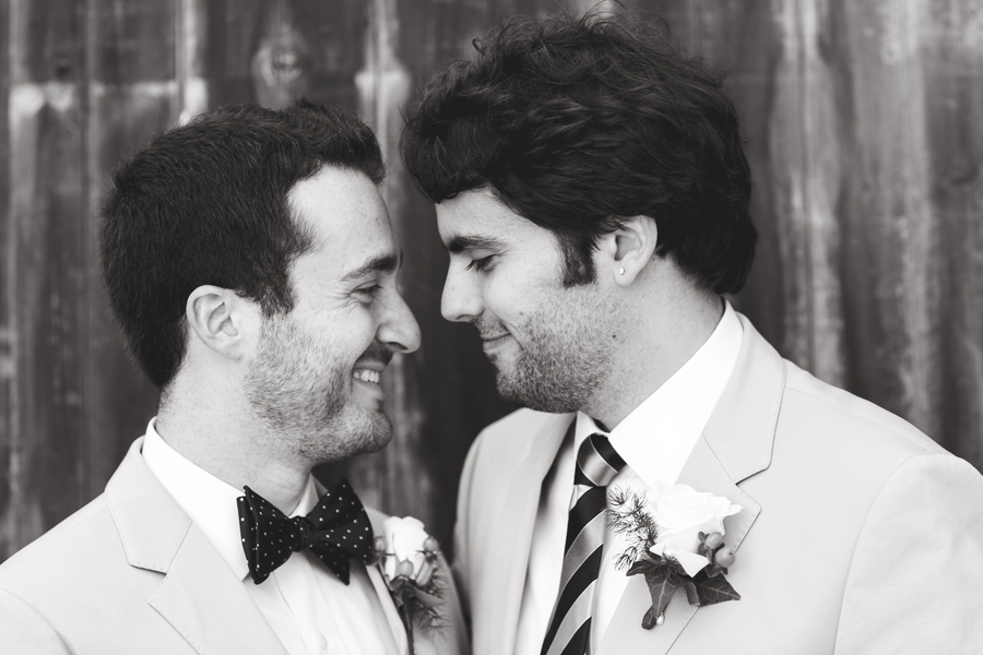 Two grooms gazing romantically - gay wedding