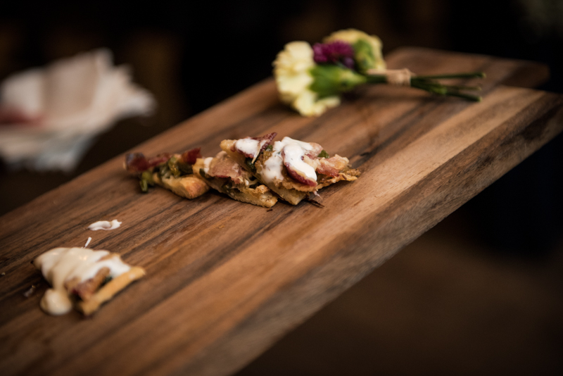 wedding reception food on wooden board