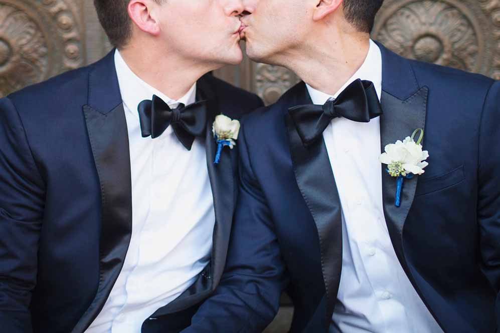 gay wedding groom kiss