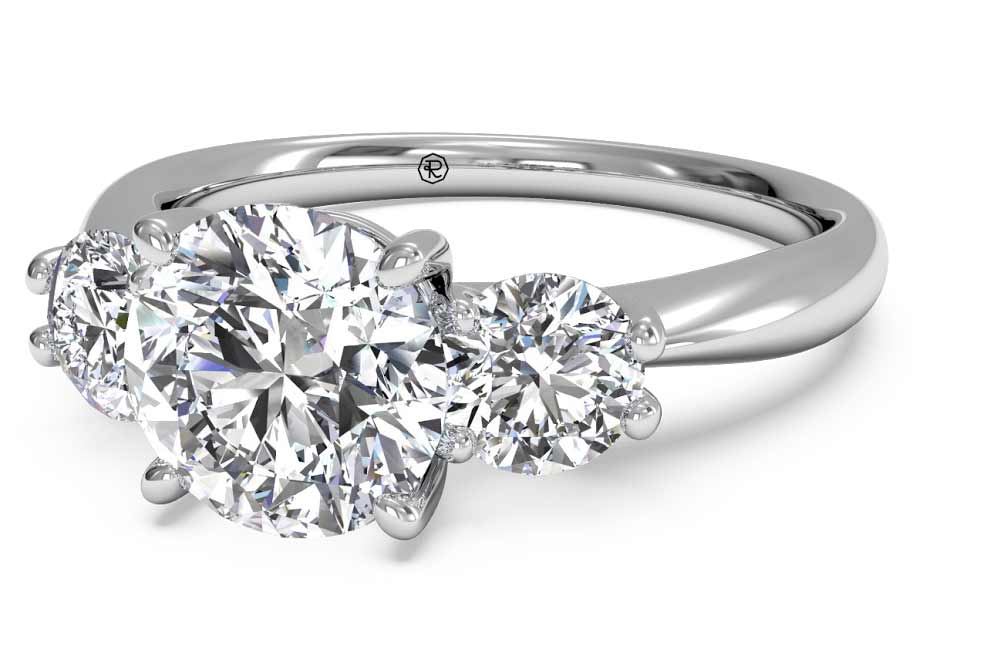 Laura Bush: Three-Stone Diamond Engagement Ring, $4,090Ritani       