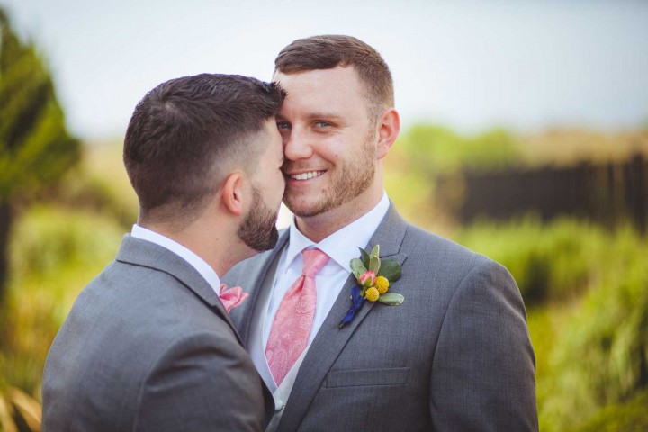 Gray and pink Virginia Beach gay wedding at Lesner Inn