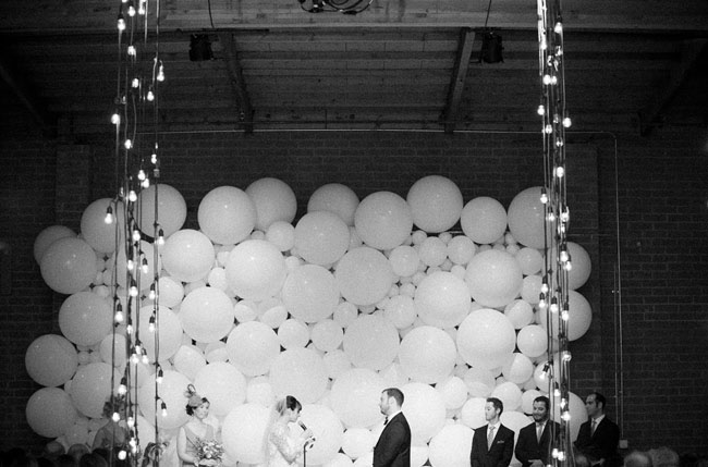 Balloon wall photo backdrop for a wedding