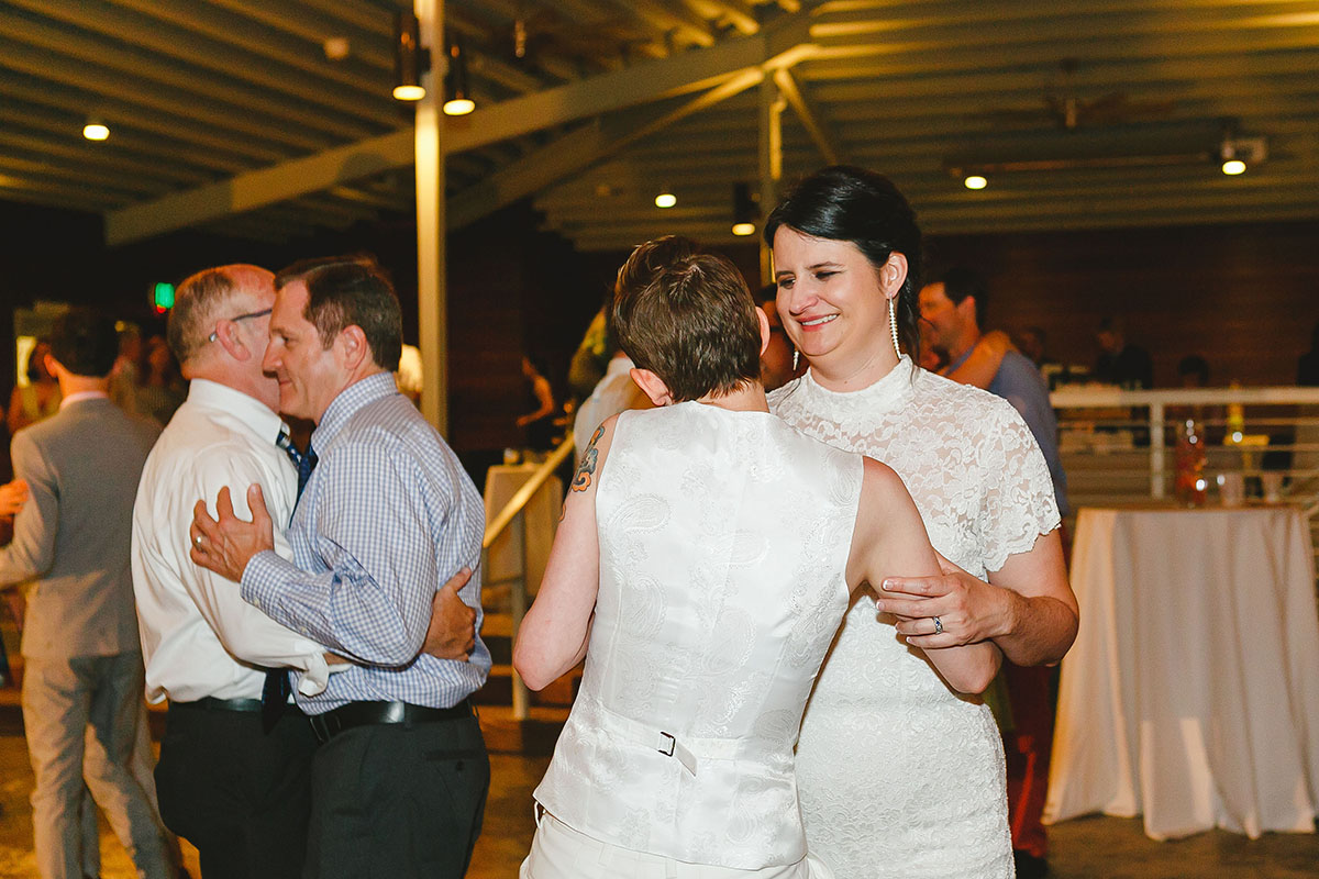 Colorful outdoor rooftop lesbian wedding in Austin, Texas first dance