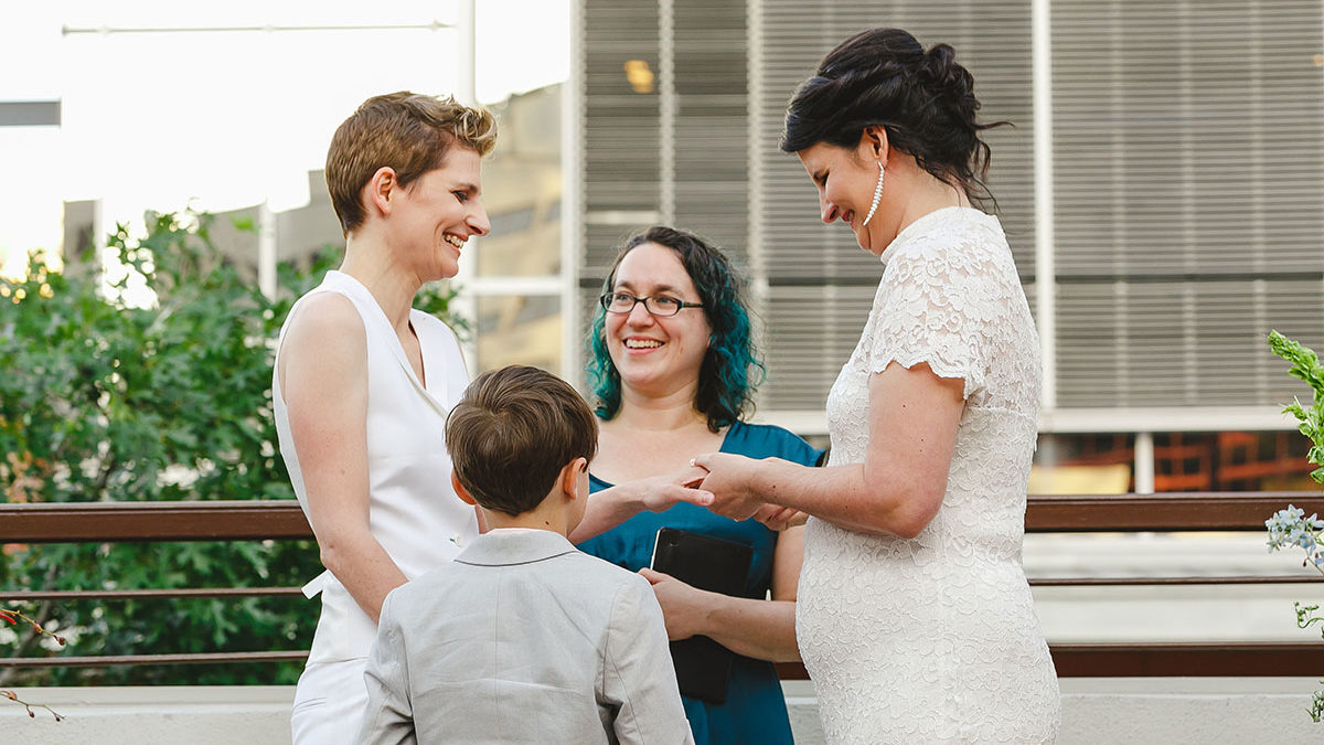 Colorful outdoor rooftop lesbian wedding in Austin, Texas