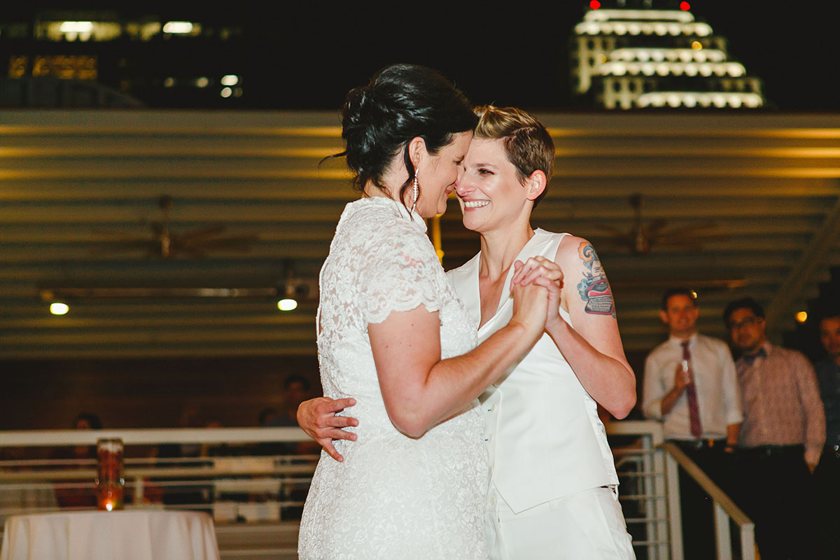 Colorful outdoor rooftop lesbian wedding in Austin, Texas first dance