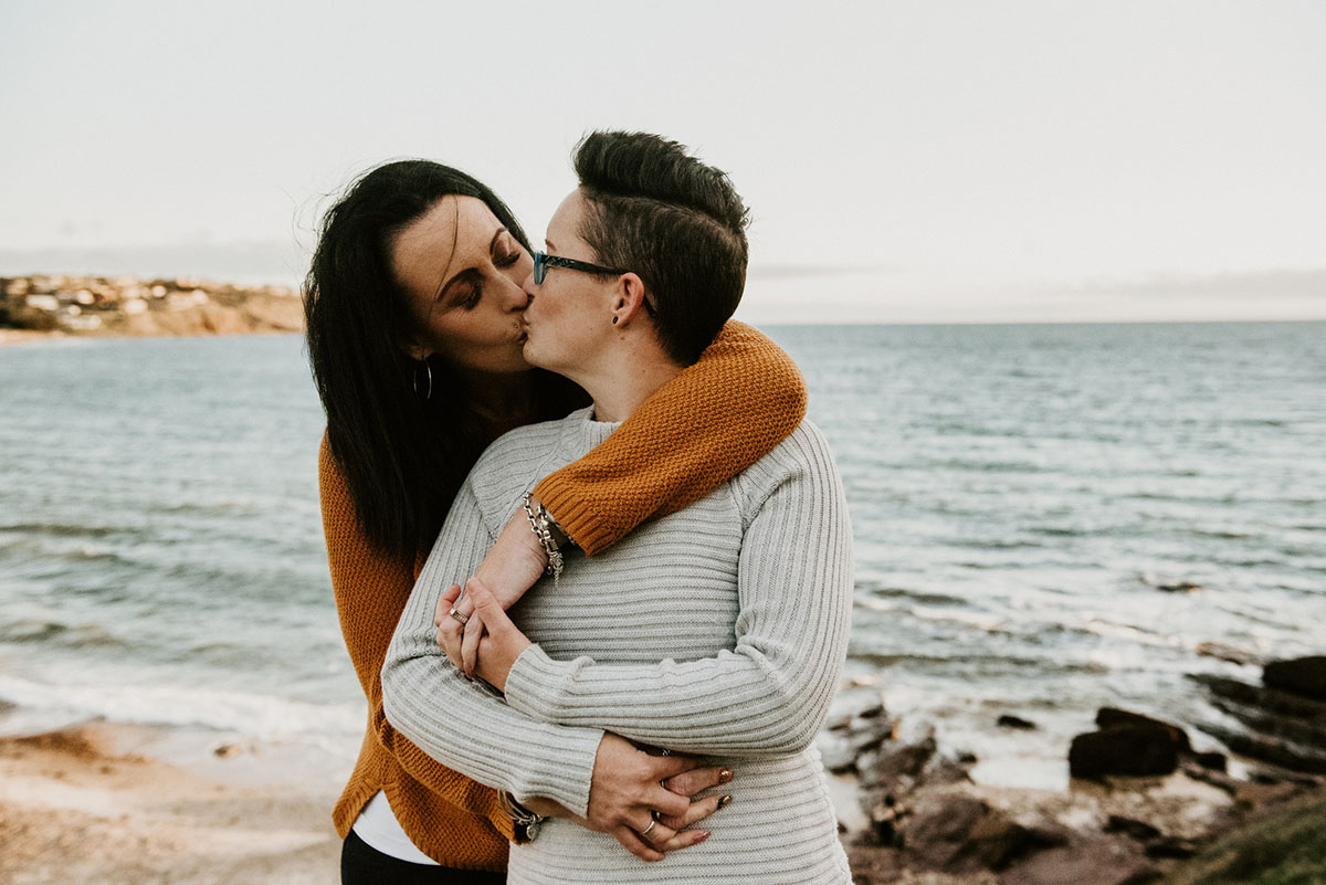 Same-sex engagement photography session on the coast of South Australia kiss