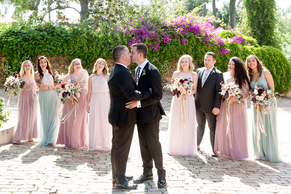 Gay wedding with Spanish Adobe theme in spring colors kiss