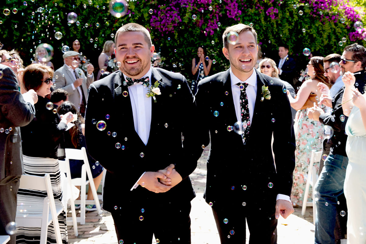 Gay wedding with Spanish Adobe theme in spring colors bubbles