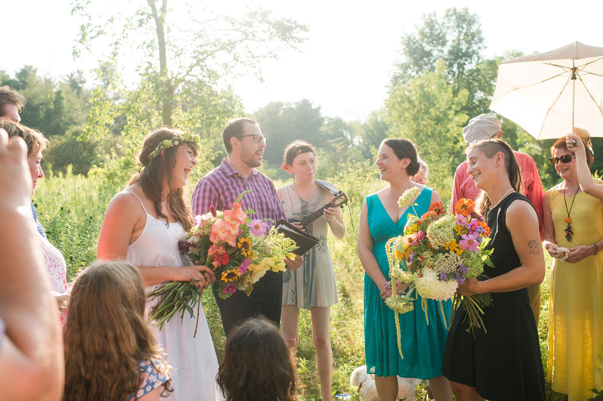Lesbian wedding with summer garden and creative floral bouquets wedding party