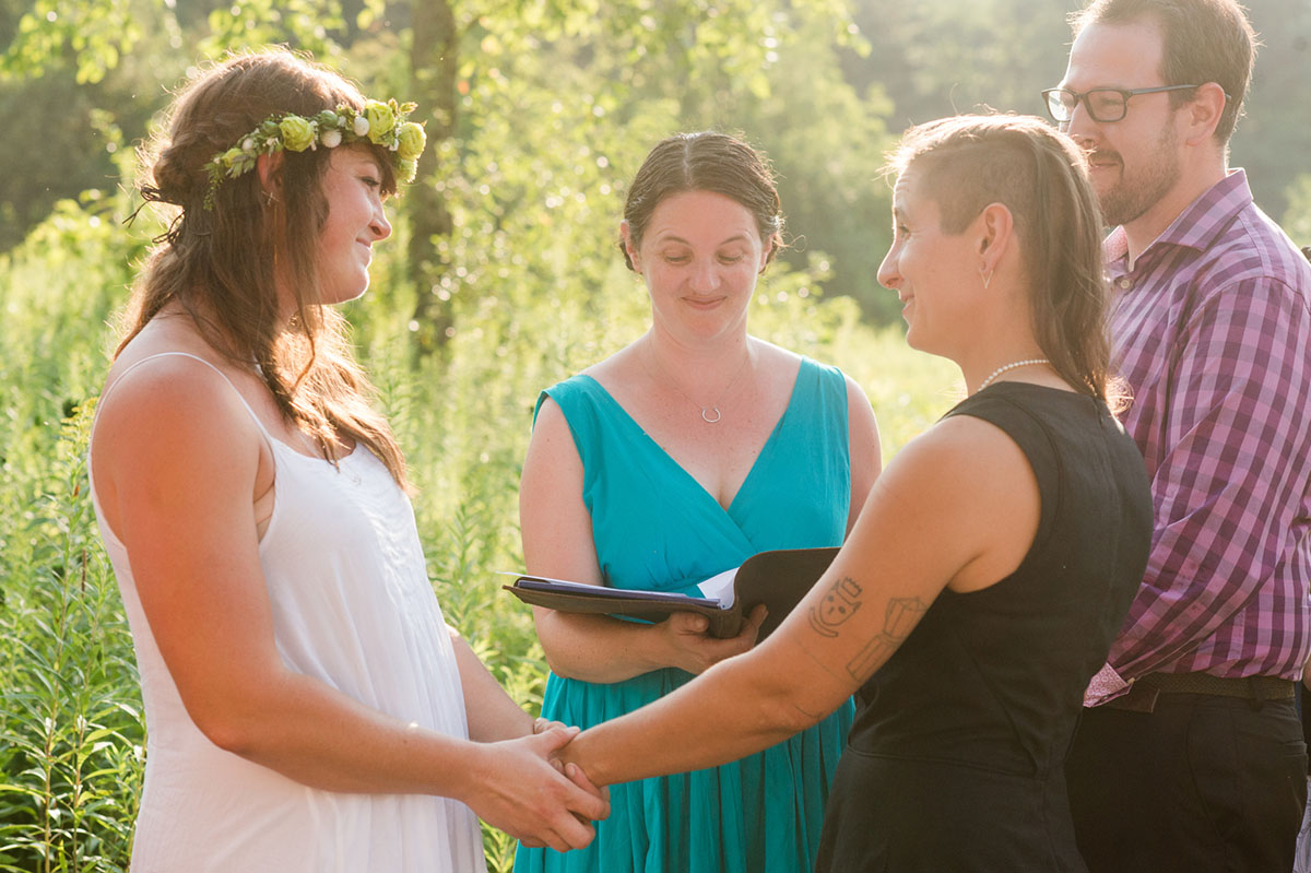 Lesbian wedding with summer garden and creative floral bouquets vows