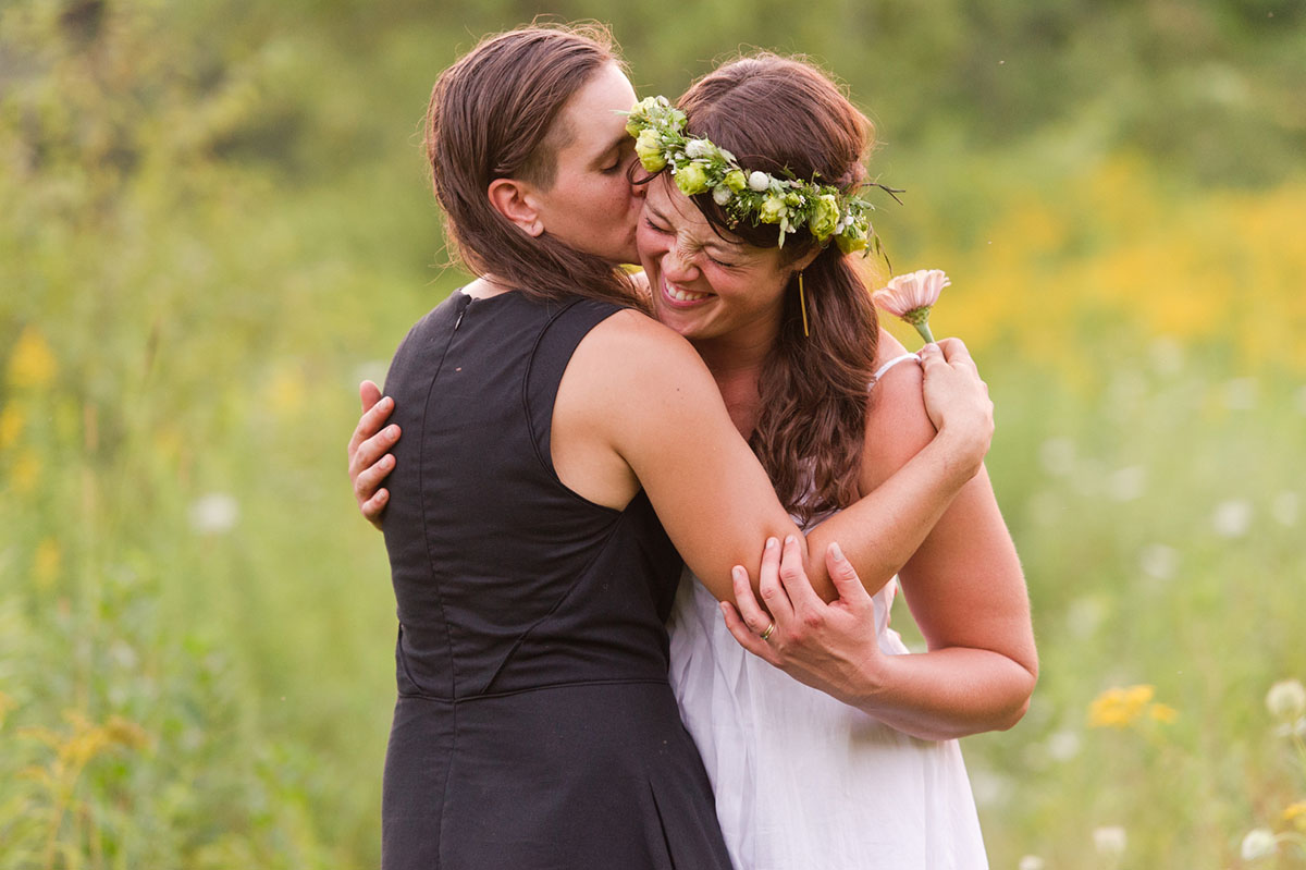 Lesbian wedding with summer garden and creative floral bouquets outdoors flower crown