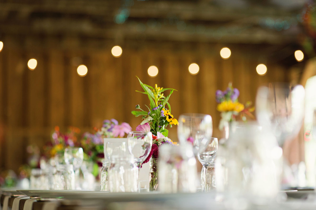 Lesbian wedding with summer garden and creative floral bouquets centerpieces