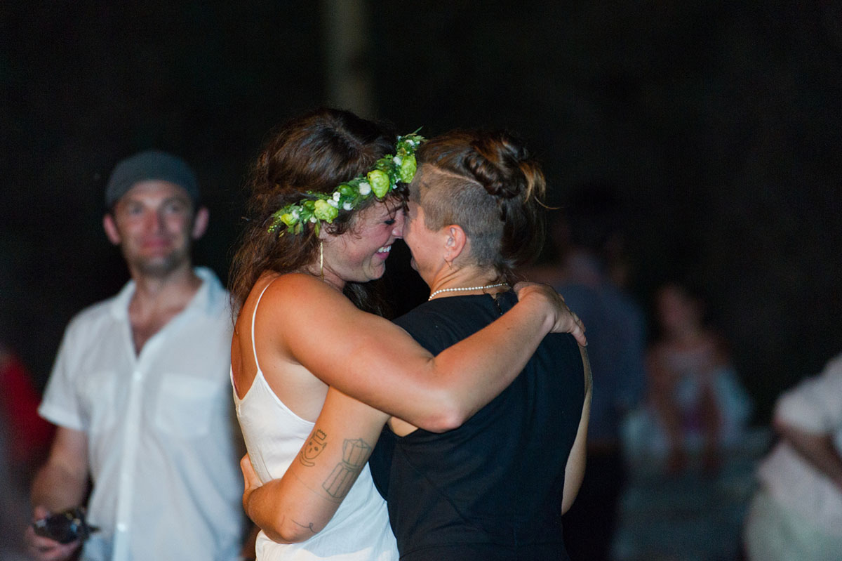 Lesbian wedding with summer garden and creative floral bouquets first dance