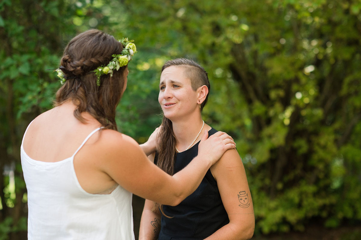 Lesbian wedding with summer garden and creative floral bouquets first look