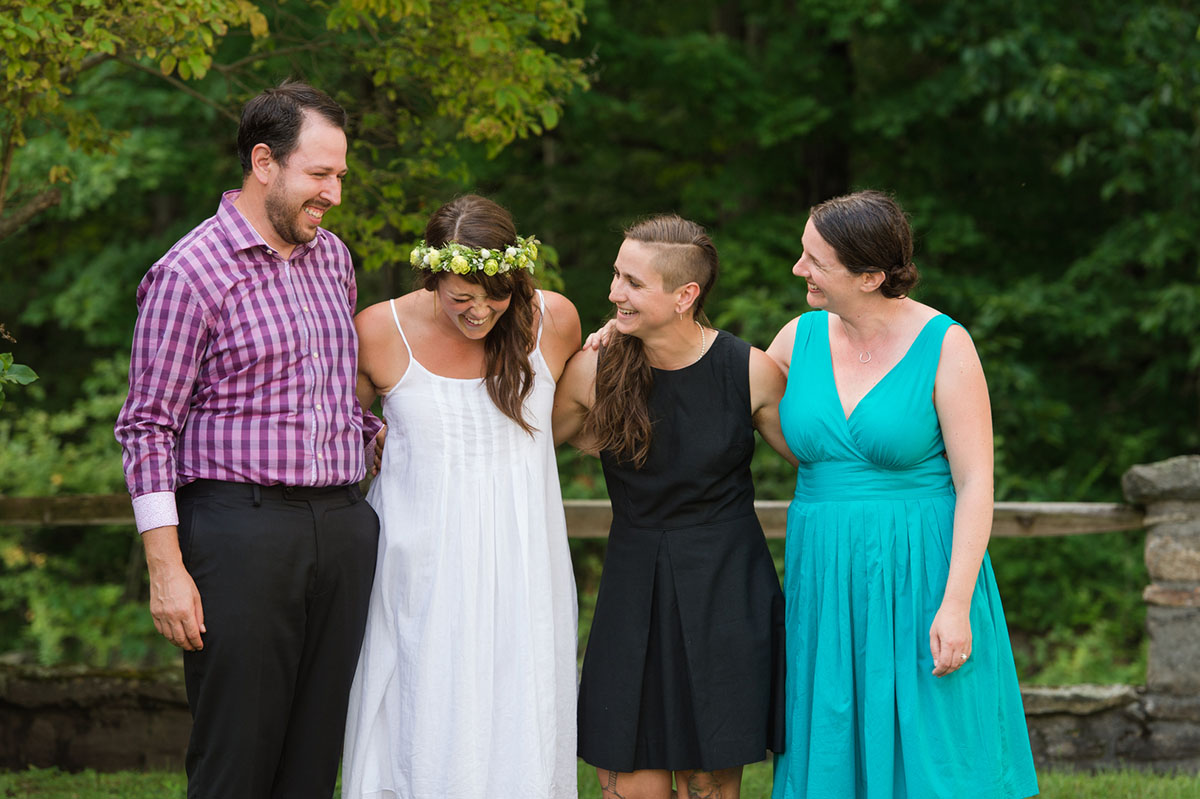 Lesbian wedding with summer garden and creative floral bouquets wedding attendees