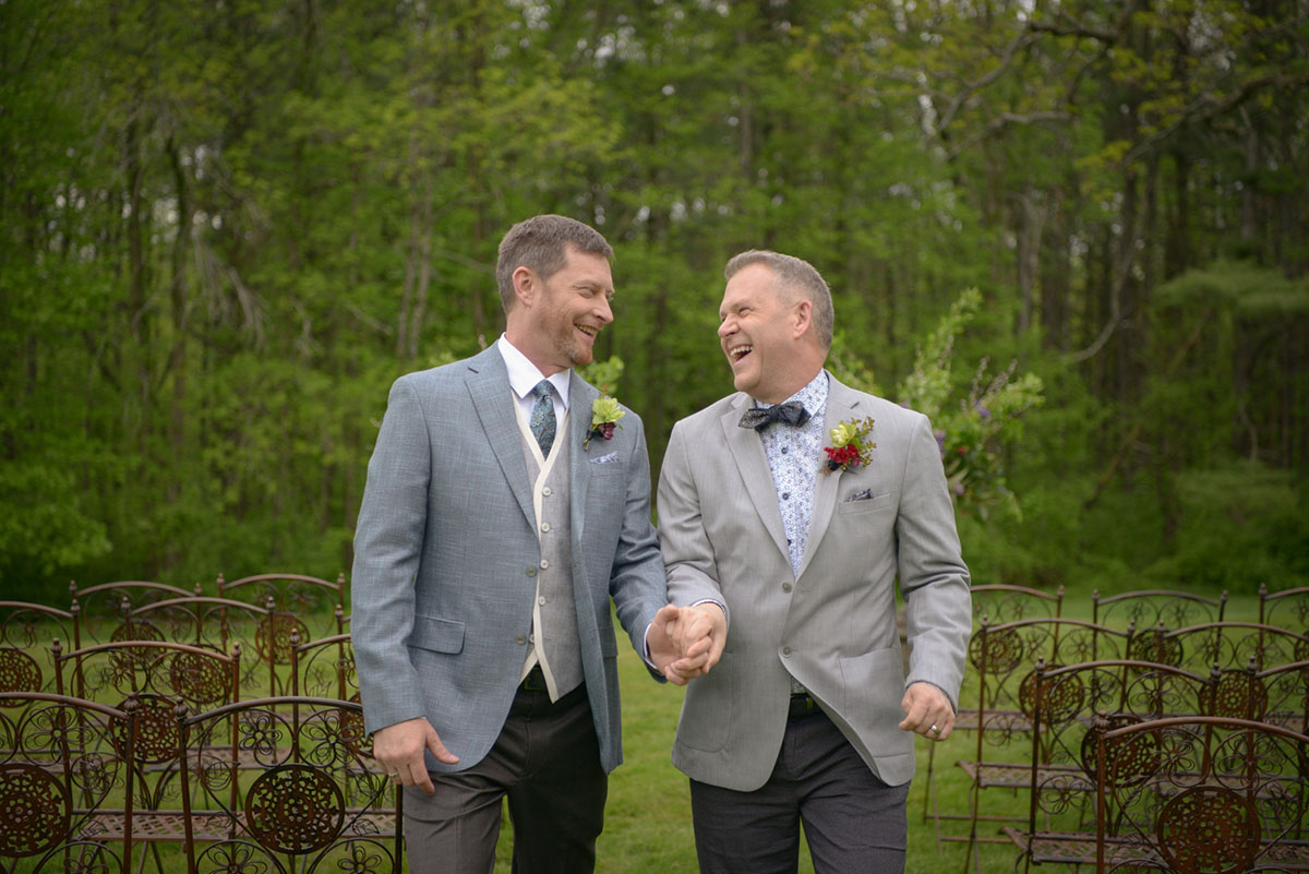 Modern gay wedding at Blantyre in the Berkshires laughing laughter
