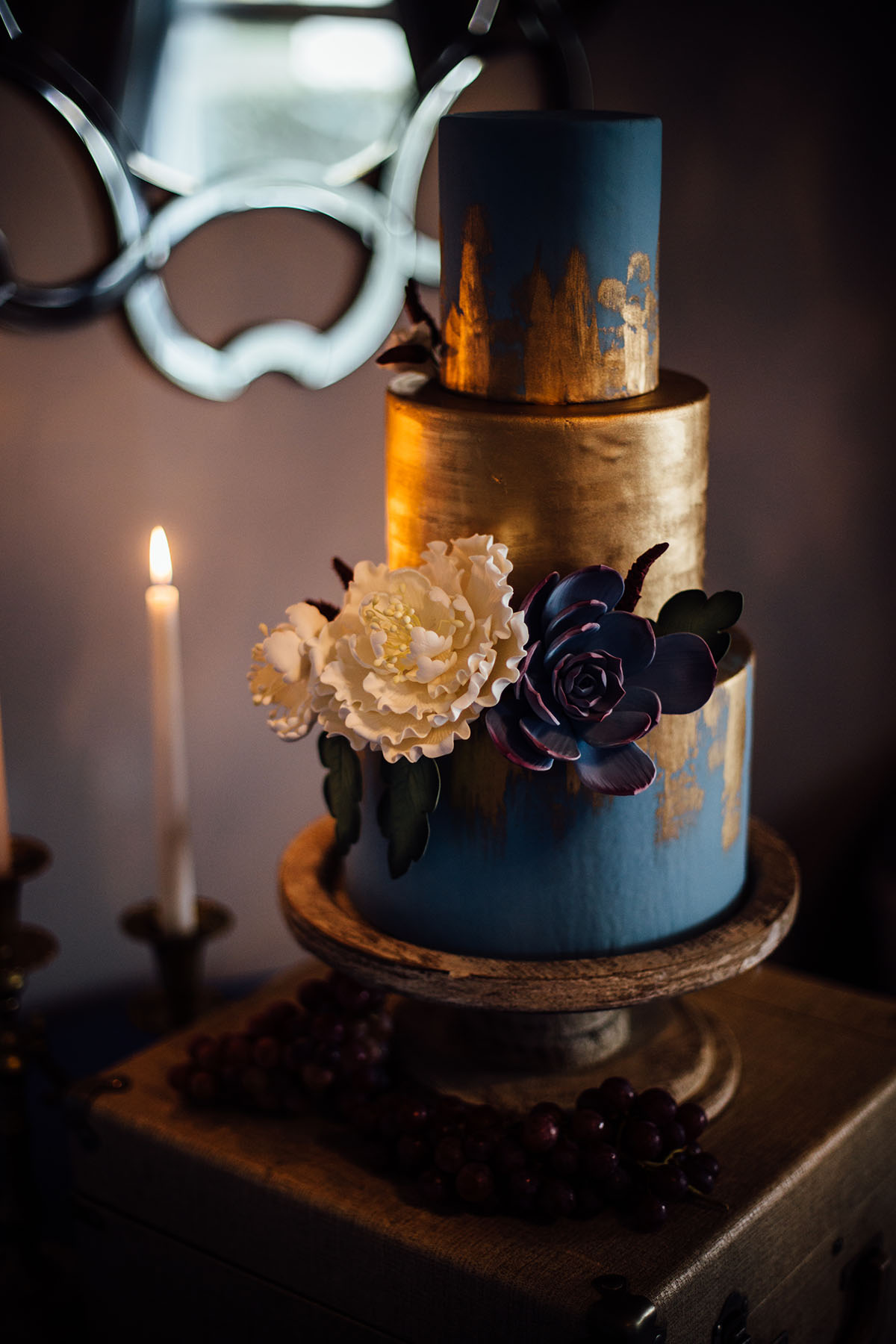 Pop-up styled lesbian wedding shoot in grays and blues cake gold leaf