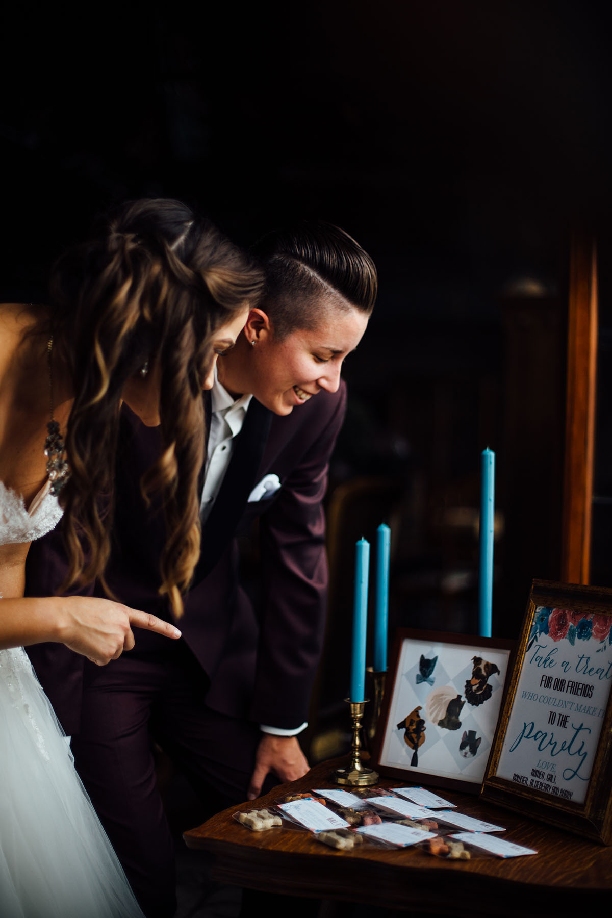 Pop-up styled lesbian wedding shoot in grays and blues candles two brides