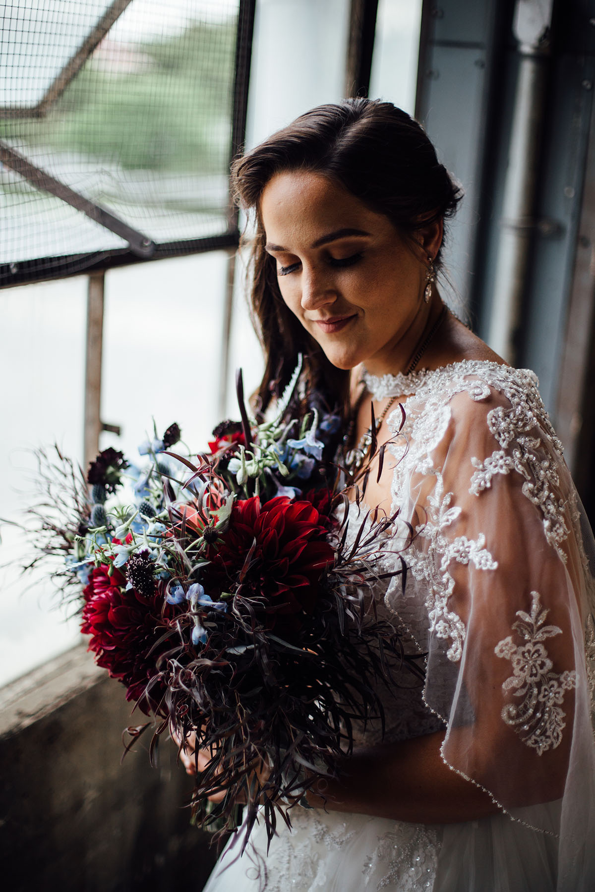 Pop-up styled lesbian wedding shoot in grays and blues bouquet flowers
