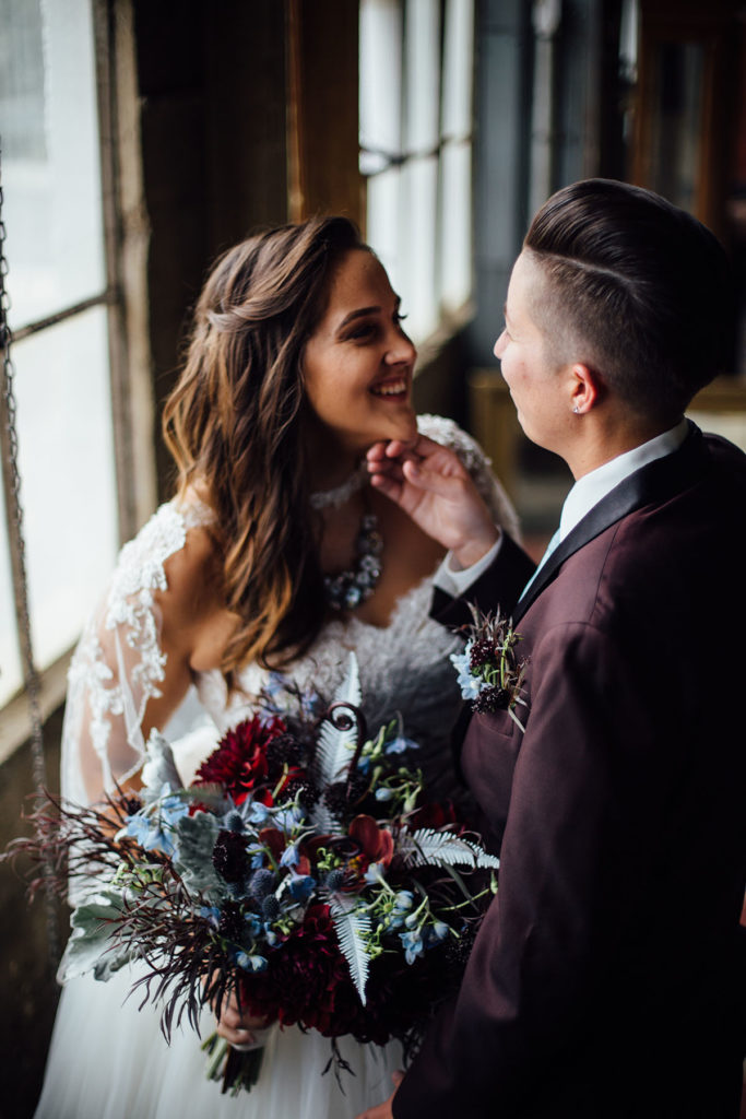 Pop-up styled lesbian wedding shoot in grays and blues
