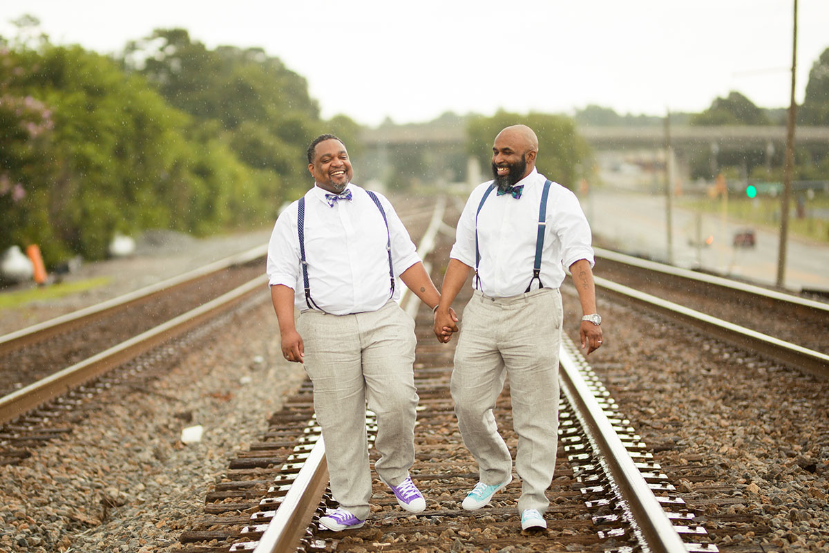 Simple, classy Georgia wedding with amethyst and aquamarine colors two grooms train tracks