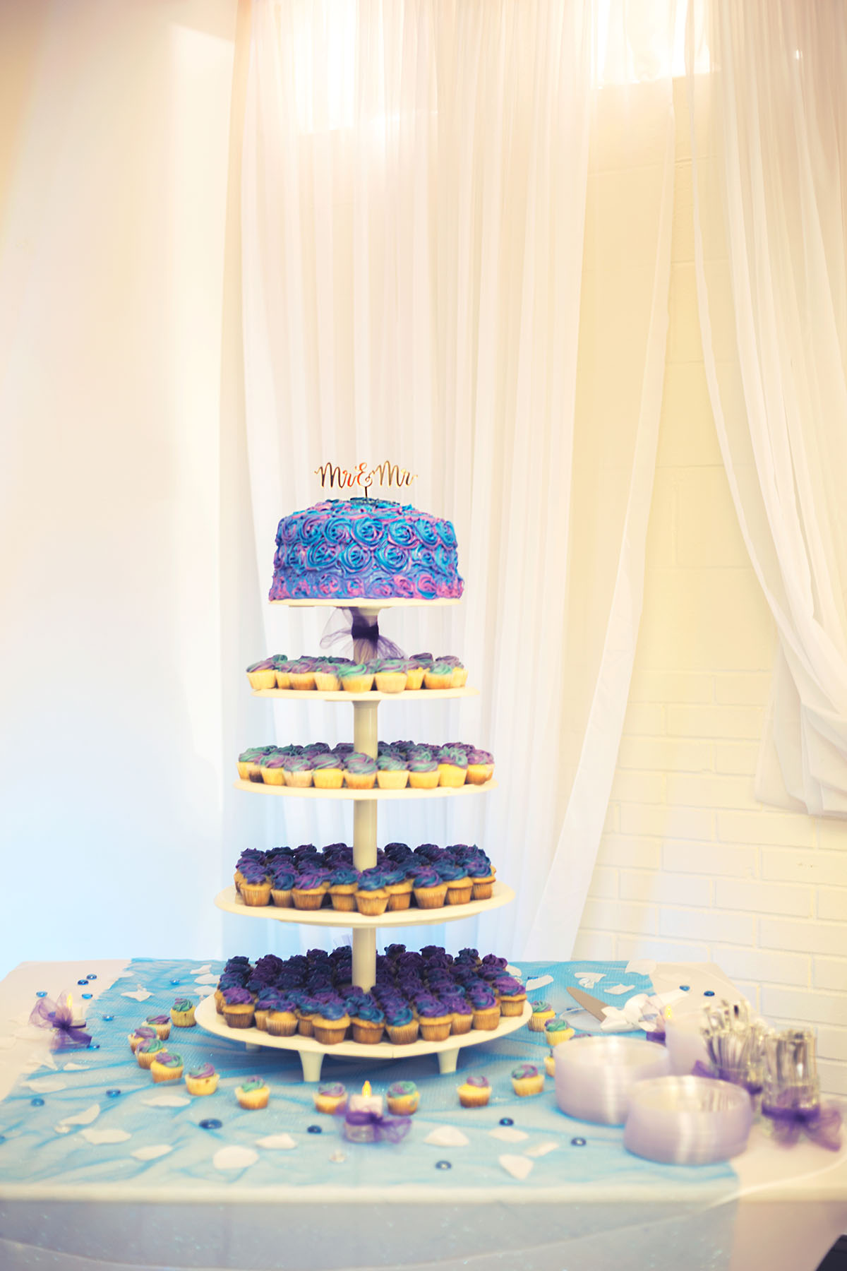 Simple, classy Georgia wedding with amethyst and aquamarine colors wedding cake and cupcakes mr. and mr.