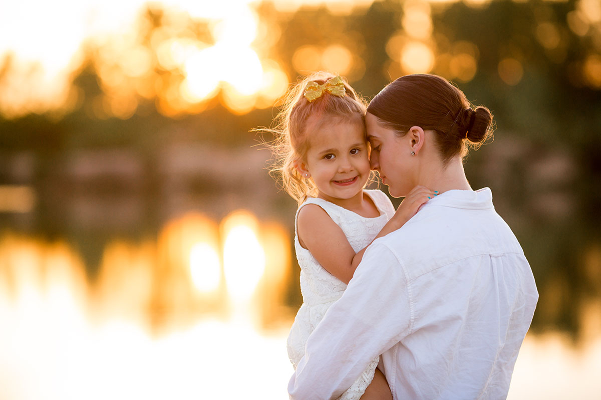 Sunset family portraits by the lake daughter