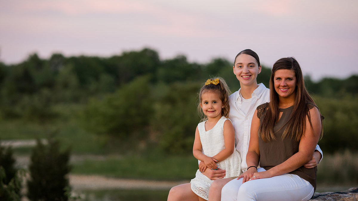 Sunset family portraits by the lake