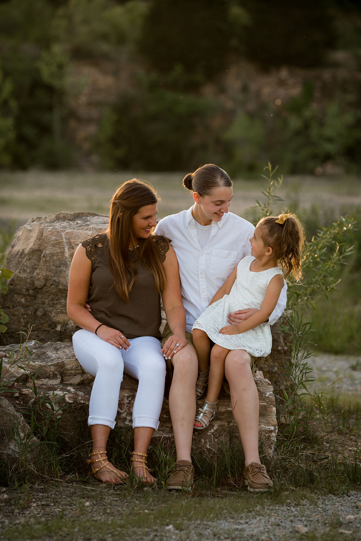 Sunset family portraits by the lake two moms daughter