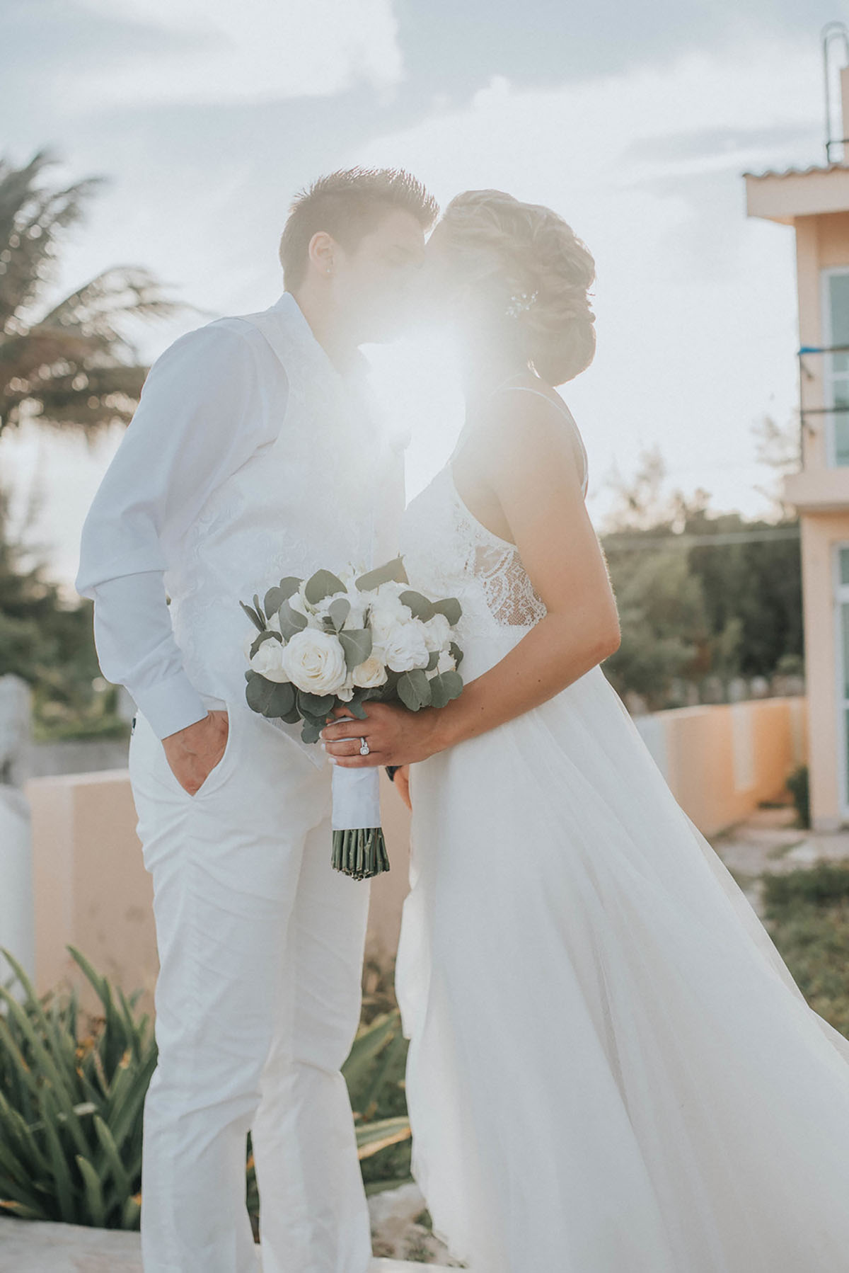 Cancun resort lesbian destination beach wedding Rachel Campbell Equally Wed brides kiss