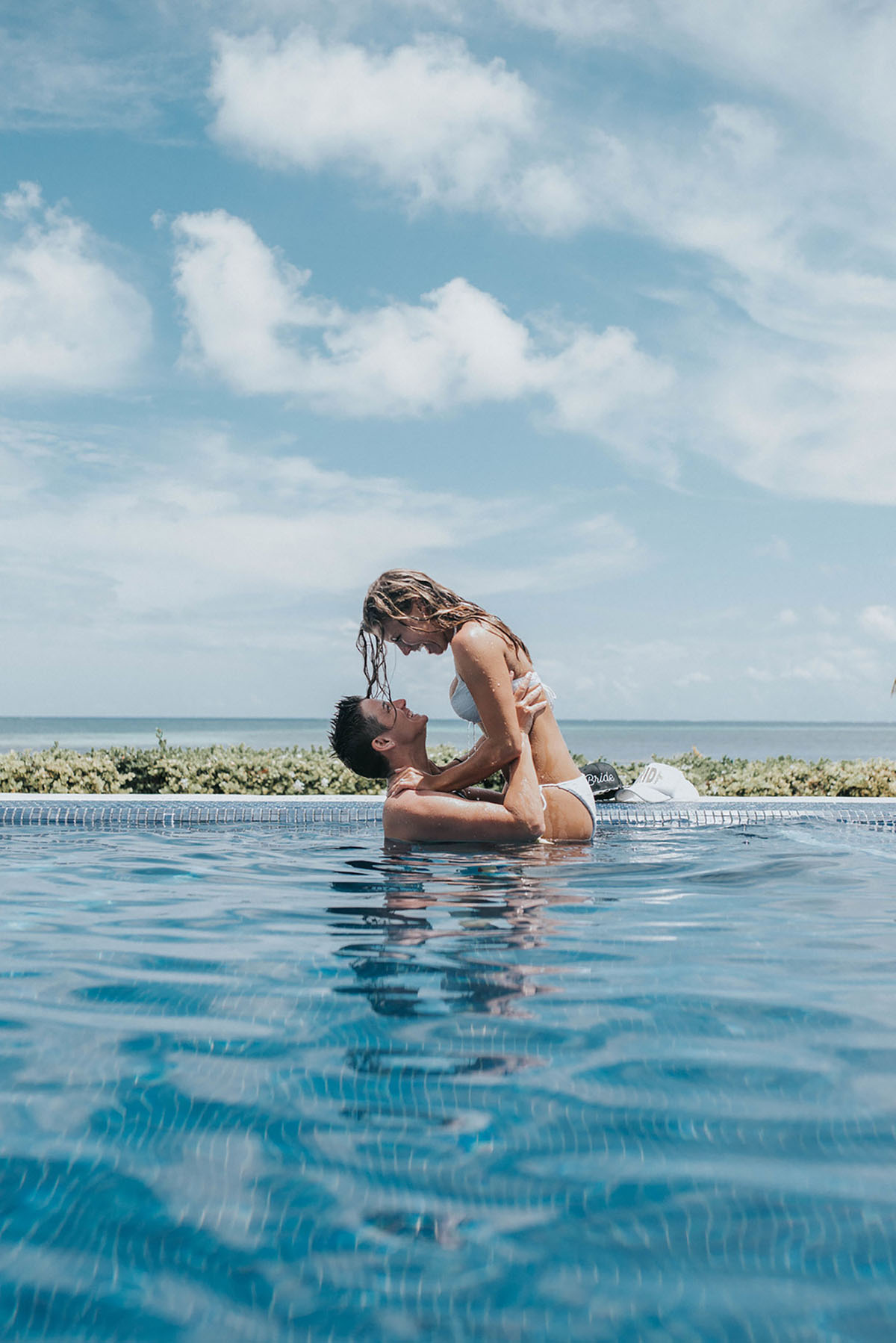 Cancun resort lesbian destination beach wedding Rachel Campbell Equally Wed brides swimming