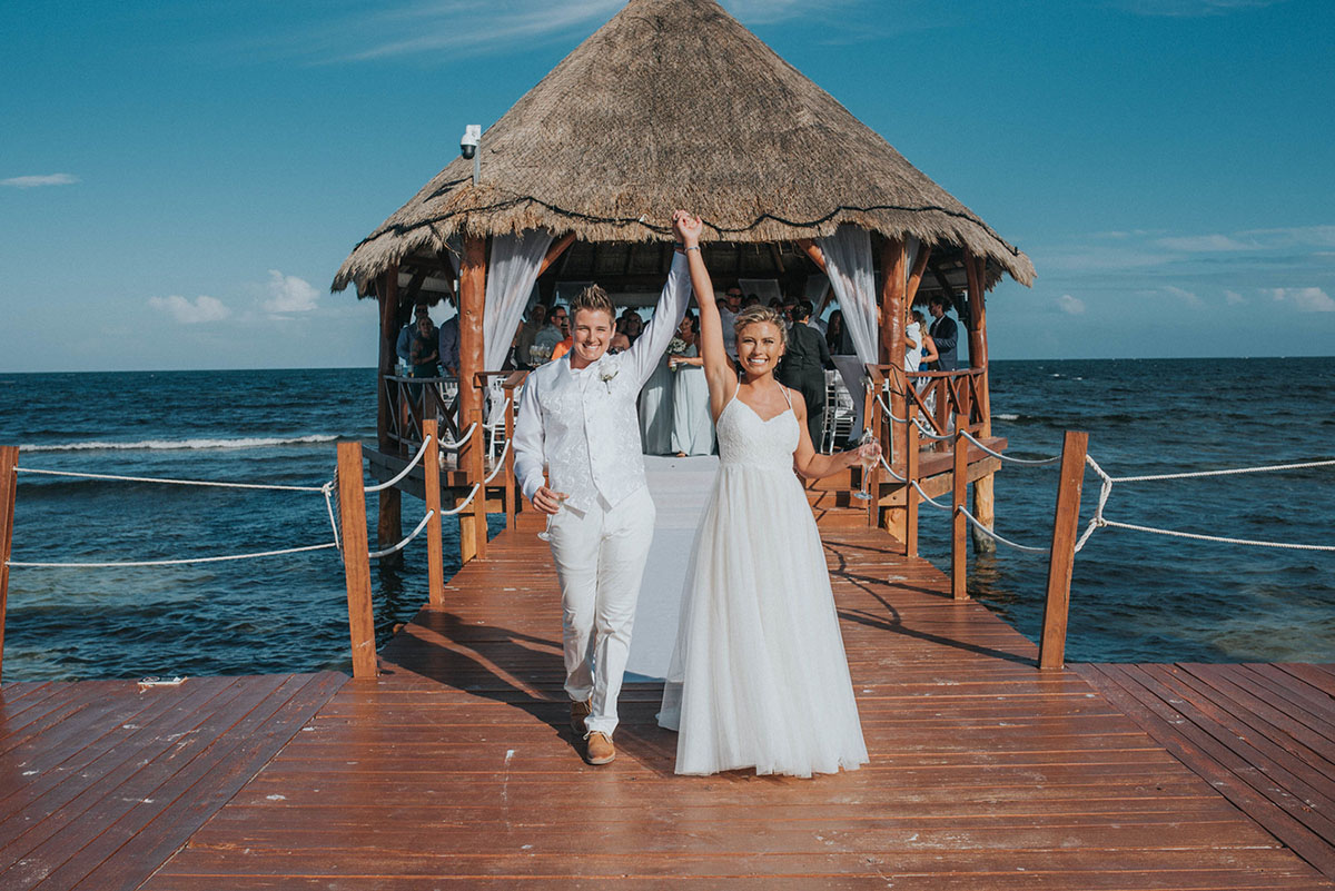 Cancun resort lesbian destination beach wedding Rachel Campbell Equally Wed brides just married