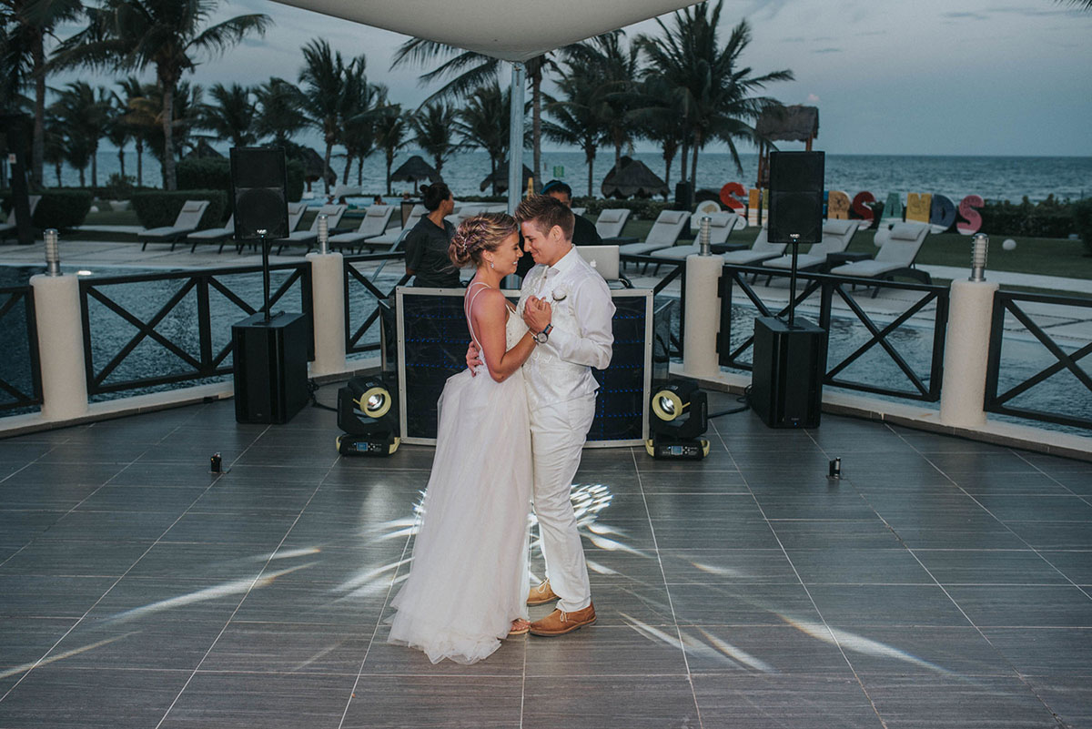 Cancun resort lesbian destination beach wedding Rachel Campbell Equally Wed brides dancing first dance