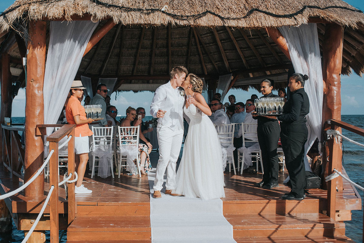 Cancun resort lesbian destination beach wedding Rachel Campbell Equally Wed kiss brides