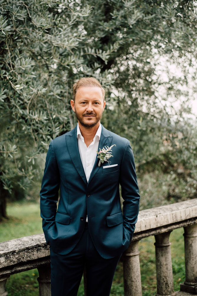 handsome groom Italian rustic moody destination gay wedding of your dreams Serena Genovese, photographer Equally Wed LGBTQ weddings