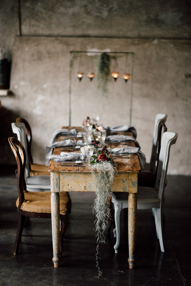 wooden table moss reception rustic moody destination gay wedding of your dreams Serena Genovese, photographer Equally Wed LGBTQ weddings