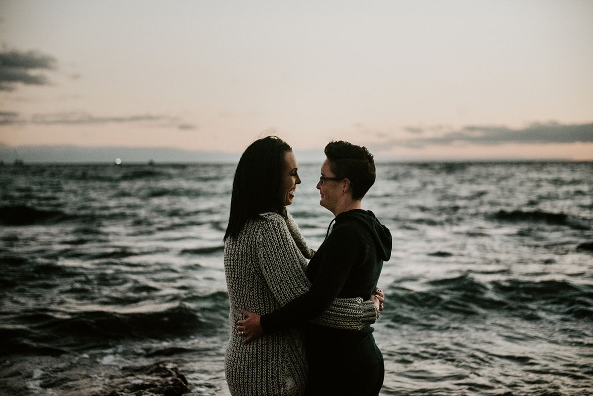 Same-sex engagement photography session on the coast of South Australia beach embrace