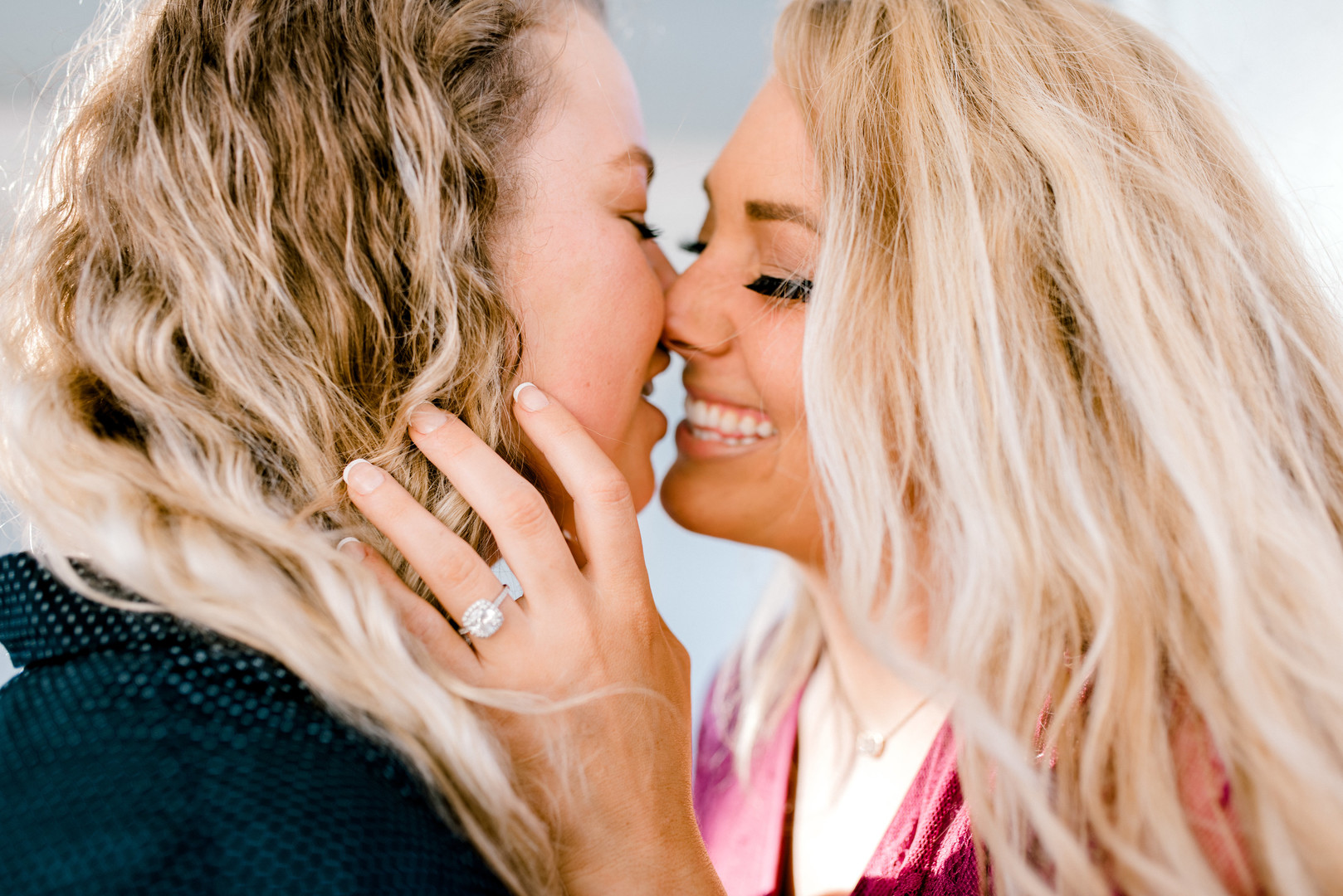 Bright, floral engagement session in downtown Dallas, Texas two blonde brides ring casual sunrise