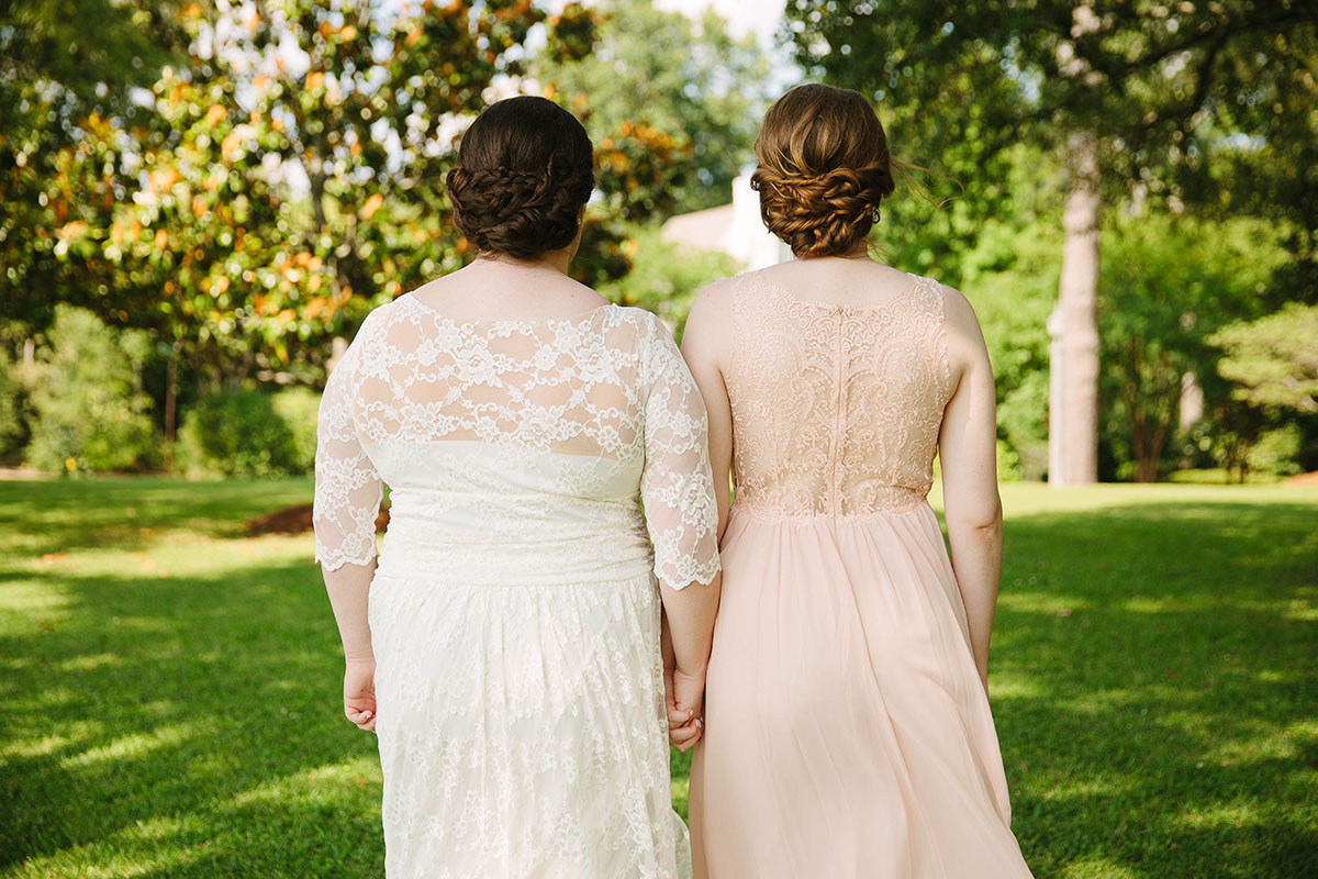 Church wedding with traditional Mississippi roots two brides lace dresses