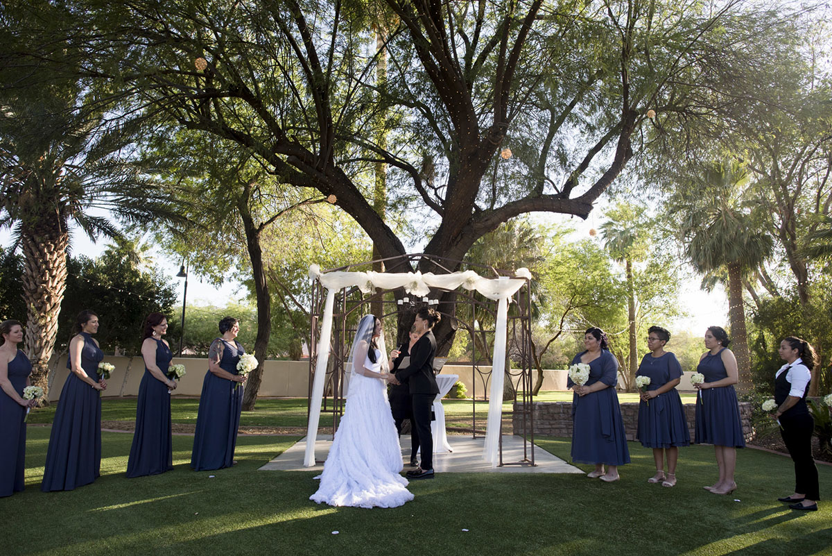 Colorful, sophisticated Latin wedding in Phoenix, Arizona two brides black tuxedo white dress