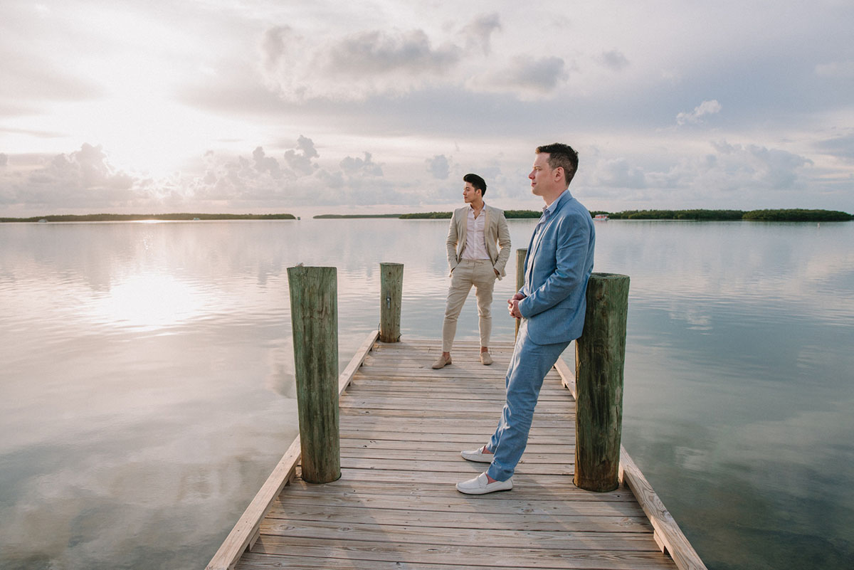 Intimate Florida Keys tropical wedding two grooms blue tan tuxedo tux