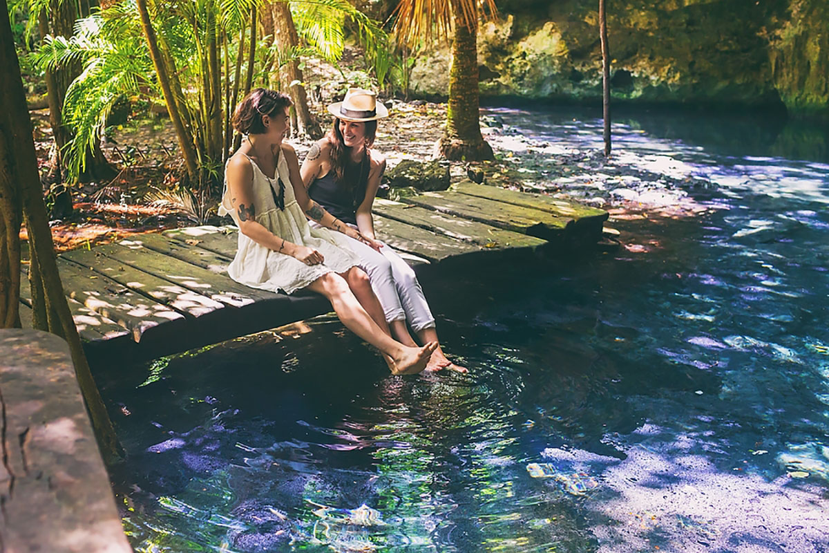Mystical surprise proposal inside a Mexican cenote two brides Mexico tattoos jungle lake